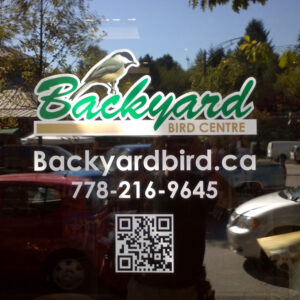 DIgital printed vinyl, gloss laminated, contour cut, installed on door.